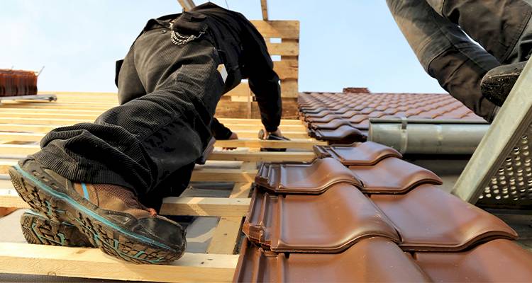 workman installling roof