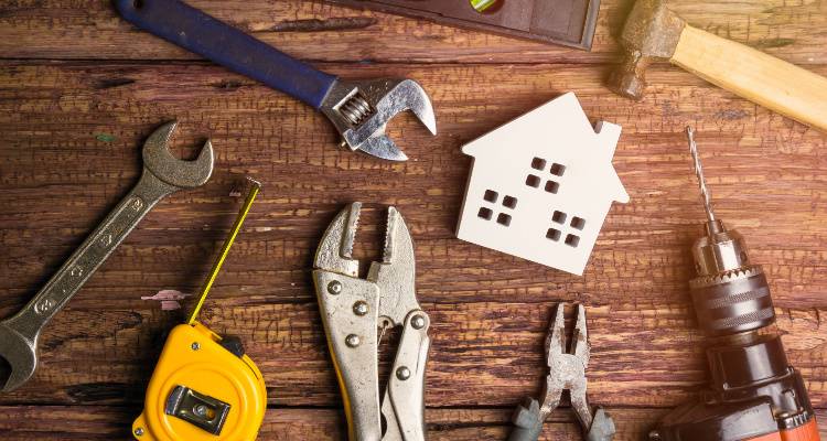 tools surrounding a house