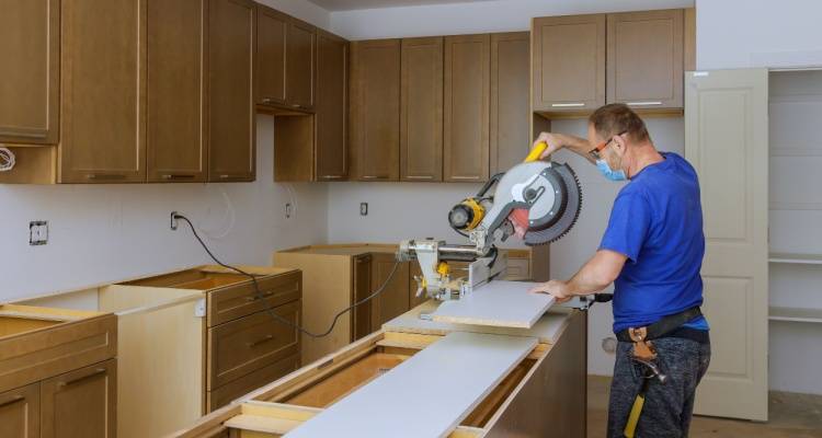 person remodelling kitchen