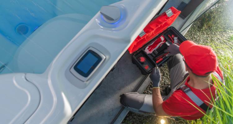 man installing hot tub