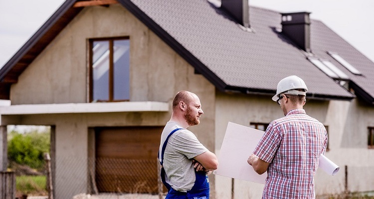 Buidling Surveyors beside a house