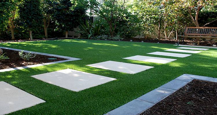 Artificial grass with paving stones