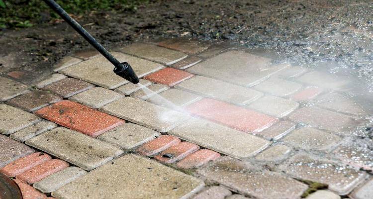 Pressure washing block paving