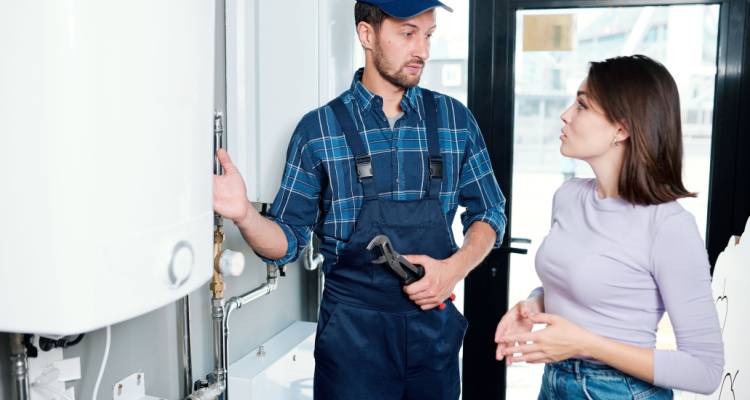 customer talking to heating engineer