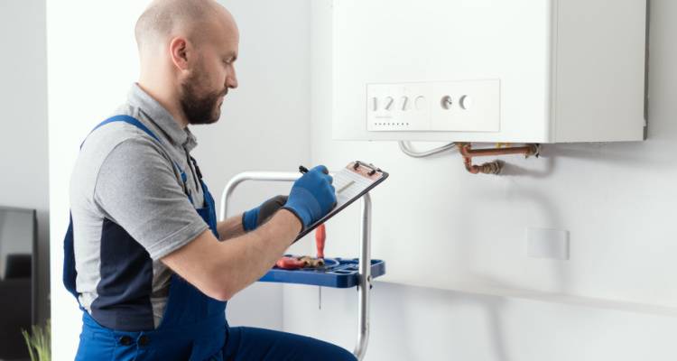 person inspecting boiler