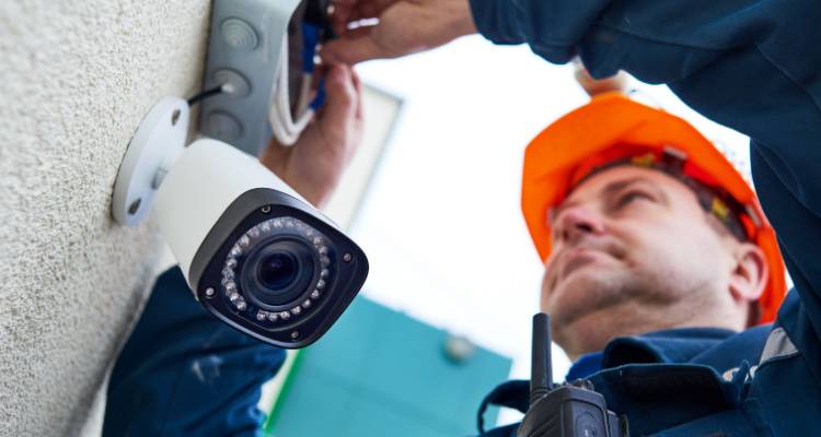 cctv installer installing a camera