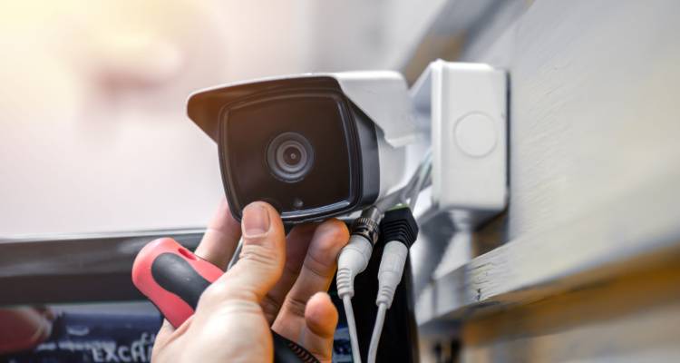 cctv installer installing a camera