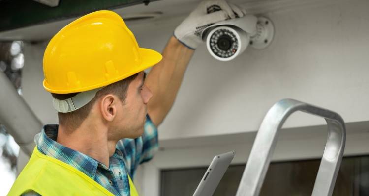 person installing CCTV