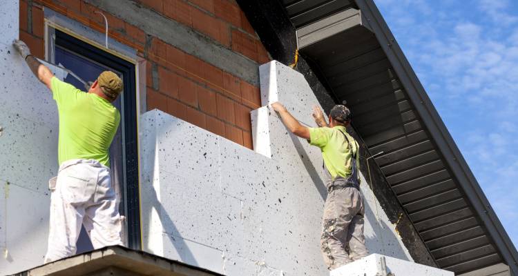 wall insulation being installed