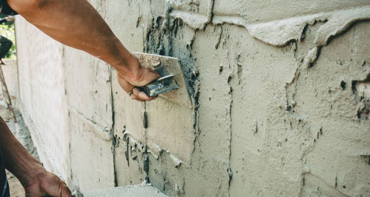 person using cement render