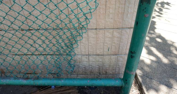 broken chain link fence