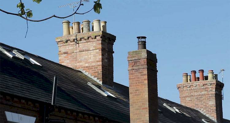 Grey chimney blue sky