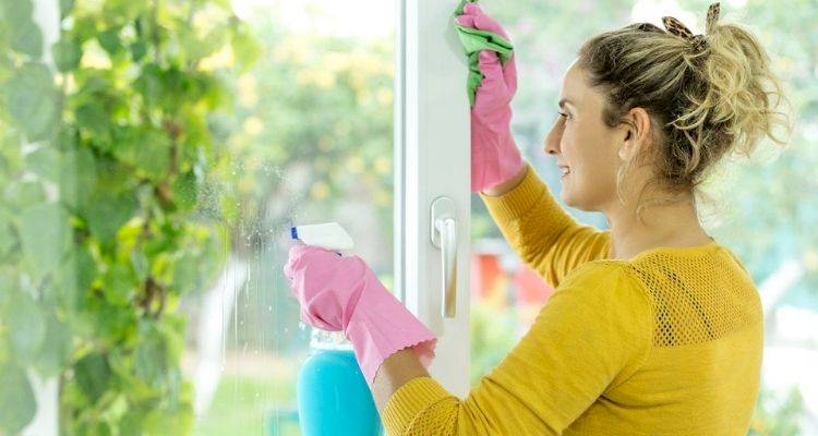 Woman cleaning windows