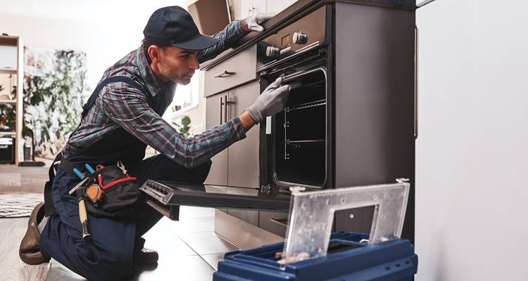 man looking in cooker