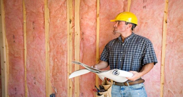 cavity wall insulation cost guide — walls being inspected by a tradesperson