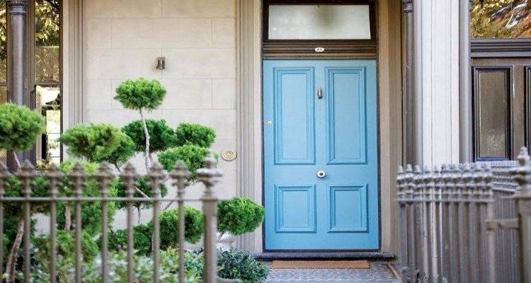 cavity wall insulation cost guide — front of a UK home