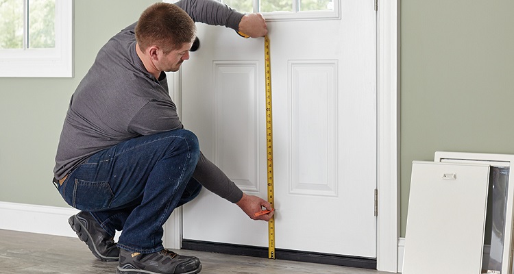 person measuring door