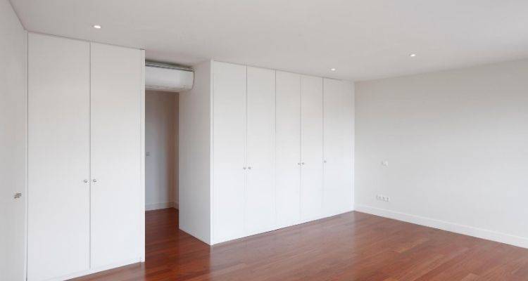 fitted gloss wardrobe with hinged doors