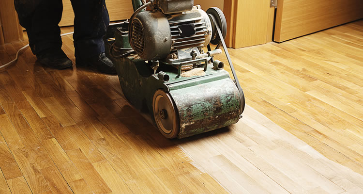 wooden floor being sanded