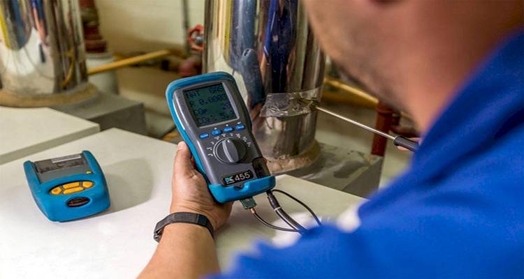 heating engineer performing tests on a boiler