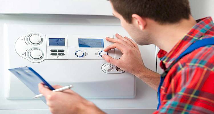 heating engineer performing a boiler inspection