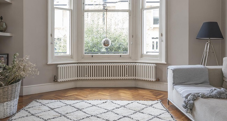 wide radiator on living room wall