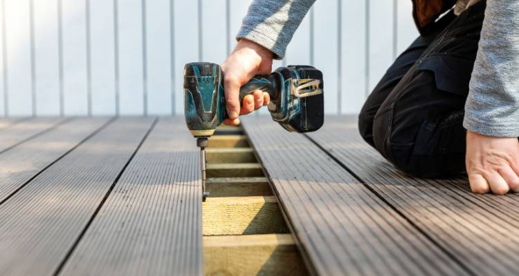 person installing decking