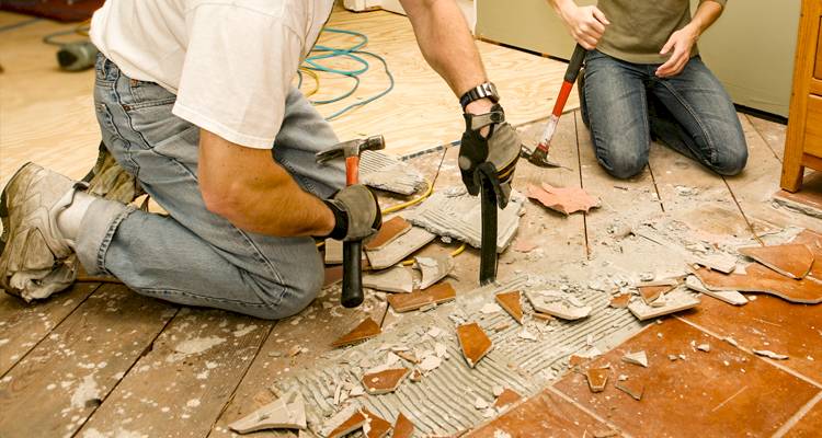 Tradespeople demolishing a house