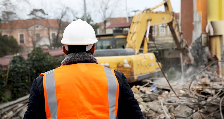 Tradesperson demolishing a home