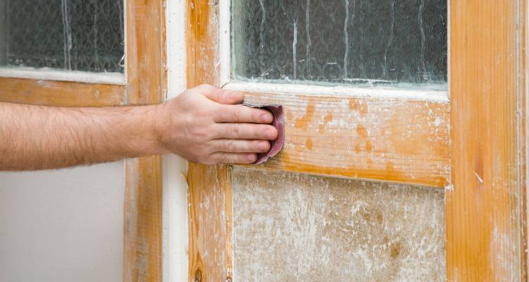 person stripping door