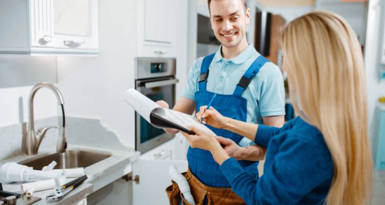 person talking to plumber