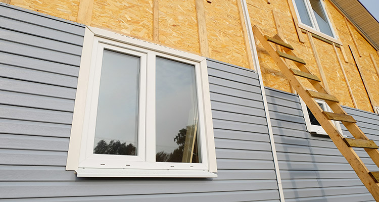 Is wood more expensive than composite cladding?