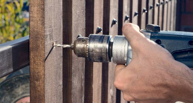 Drilling a wooden fence