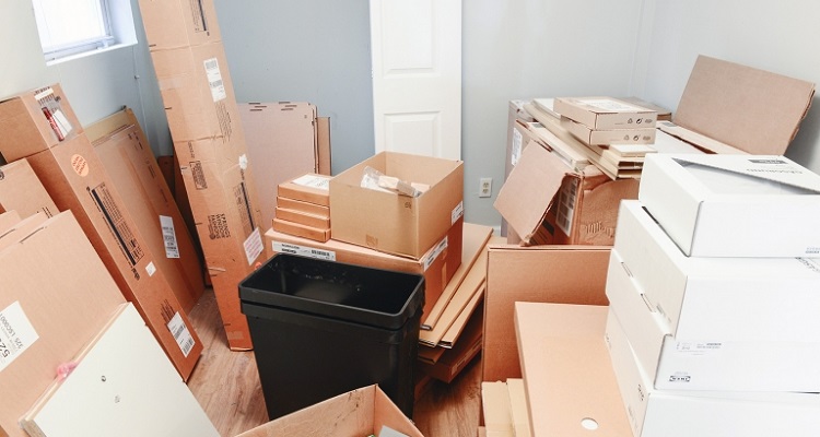 room with flat pack cardboard boxes