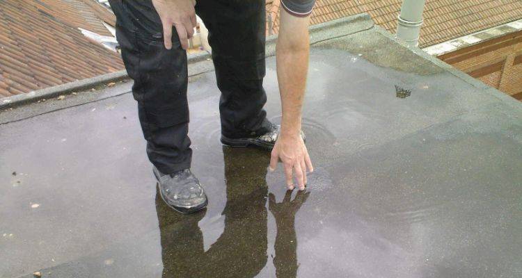 puddling on a flat roof requiring repair