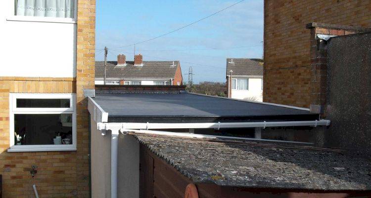 back of a garage with flat roof