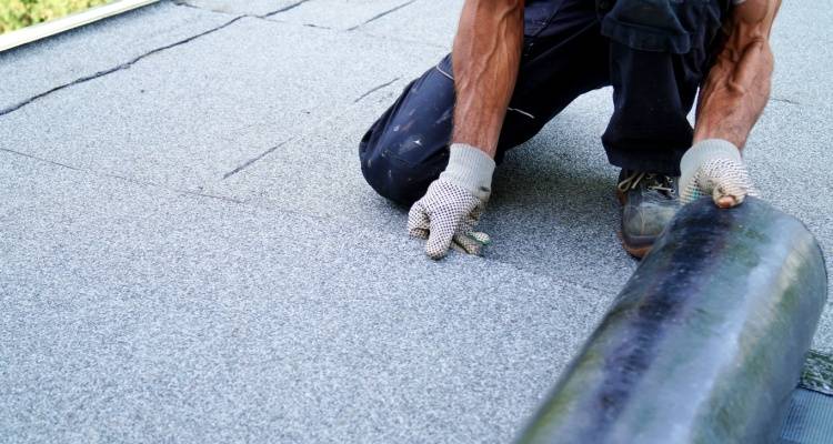 person installing flat roof