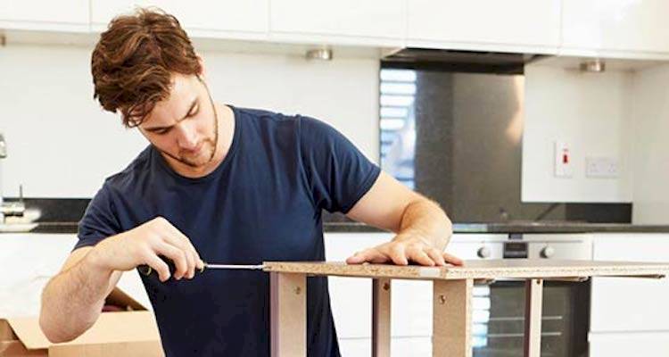 Man assembling flat pack furniture