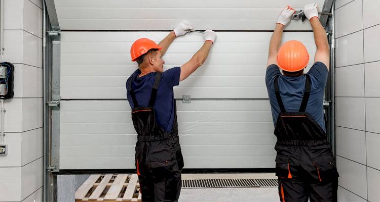 2 workmen in orange hardhats