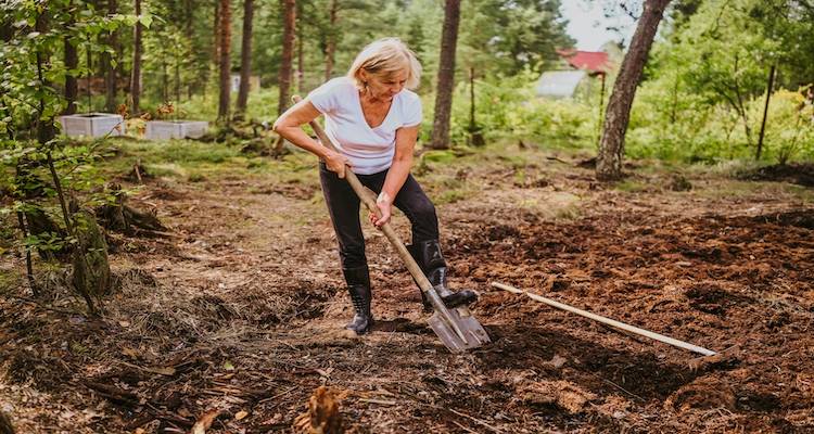 woman levelling a garden