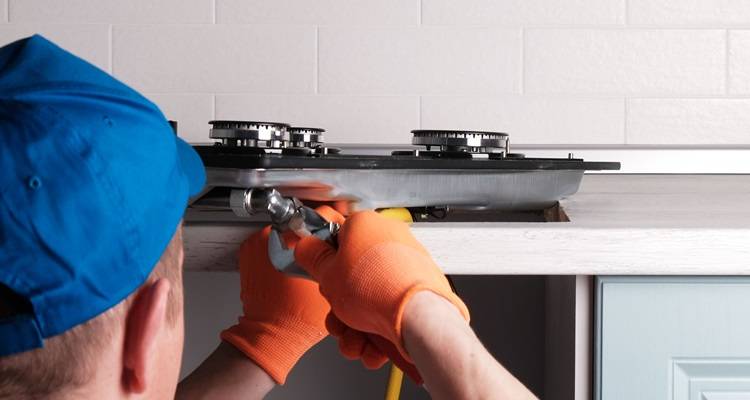 man fitting hob