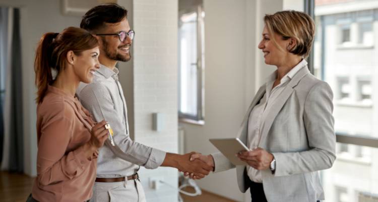 couple meeting real estate agent