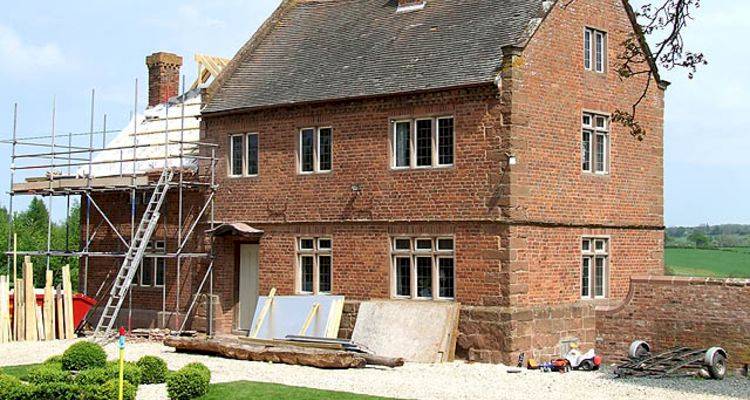 house extension cost guide — building project being conducted on a UK property