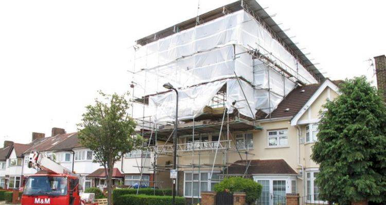 house extension cost guide — a large extension being added to a UK home