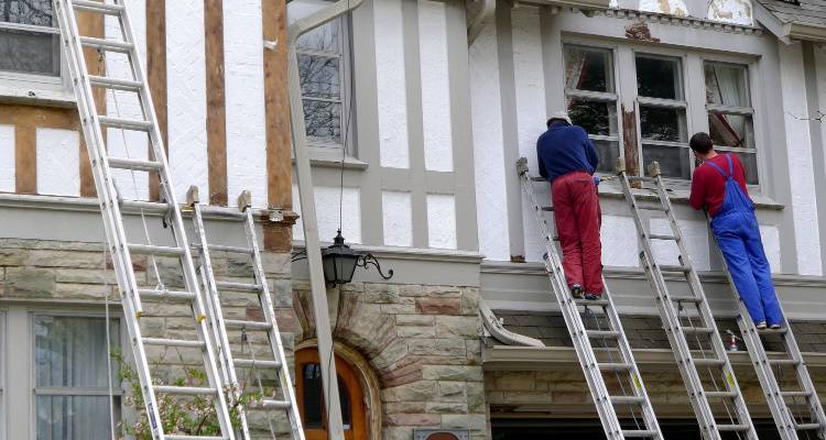 people painting house