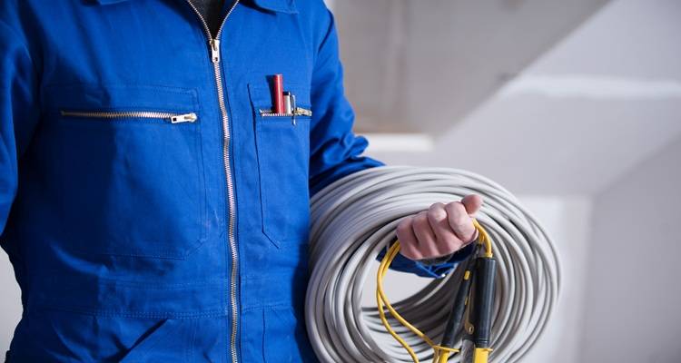 person blue torso holding wire