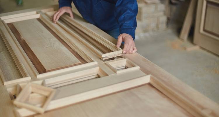 man making door
