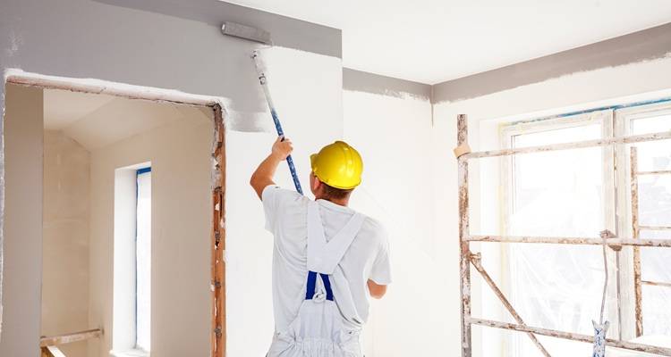 man rolling walls
