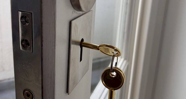 locksmith cost guide — closeup of a door locking system