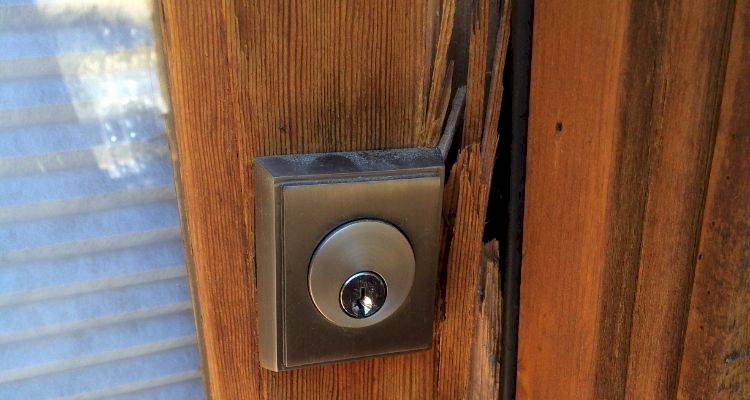 locksmith cost guide — closeup of a damage locking system